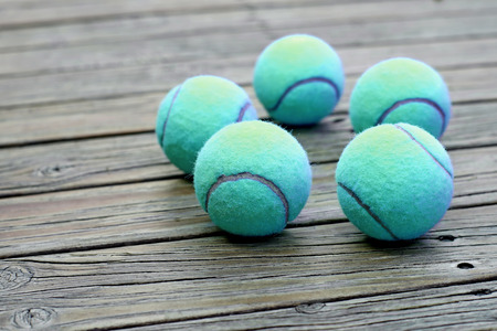 exotic blue tennis ball  on wooden backgroundの写真素材