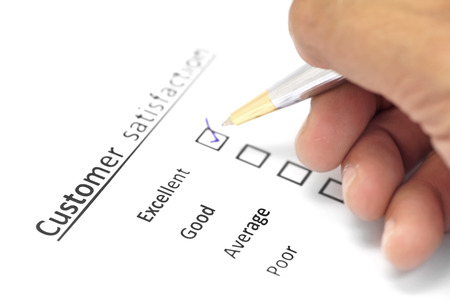 customer satisfaction survey form with the pen checked excellent in checkboxの写真素材