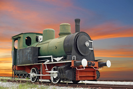 old steam engine locomotive train with beautiful twilight backgroundの写真素材
