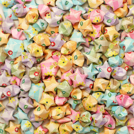 colorful of origami lucky stars as backgroundの写真素材