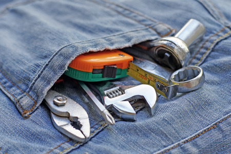 several tools in denim workers pocket jeansの写真素材
