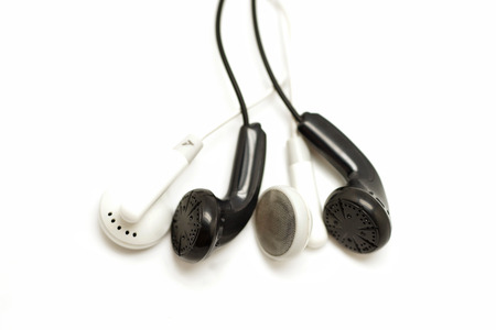 black and white earbuds isolated on white background