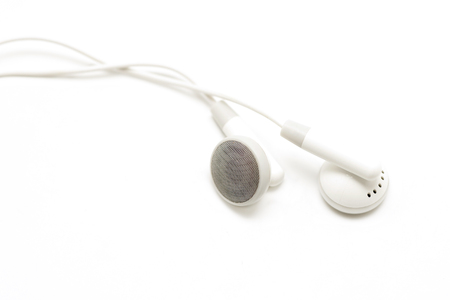 white audio earbuds isolated on white backgroundの写真素材
