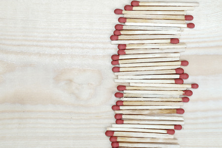 matchstick line on wooden background