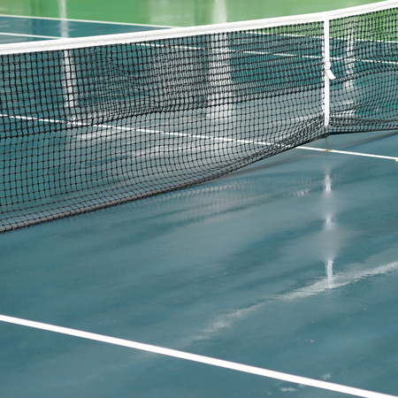 wet tennis court after the rainの写真素材