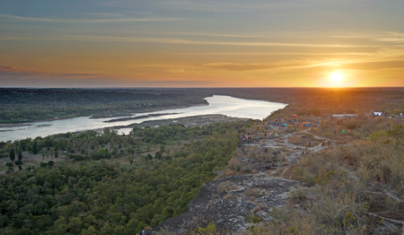river in wild with beautiful sunset backgroundの写真素材