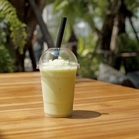 smoothy cantaloupe melon juice on wooden tableの写真素材