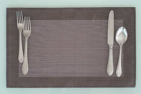 spoon fork and knife on the tableclothの写真素材