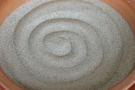 a empty sand ashtray with circle patternの写真素材