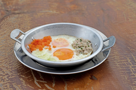Indochina pan fried egg with pork and toppingsの写真素材