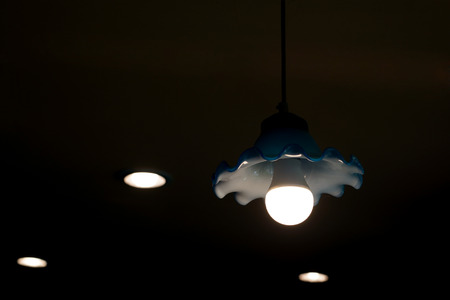 energy saving fluorescent light bulb in hanging lampの写真素材