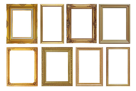 pile of antique golden picture frames isolated on white backgroundの写真素材