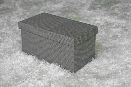 gray gift box on carpetの写真素材