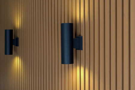 modern wall lamp with light on wooden slatの写真素材