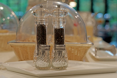 salt and pepper shakers on buffet lineの写真素材