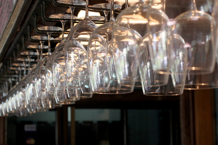 pile of empty transparent glasses on shelfの写真素材