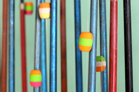 fishing poles lined up in a row backgroundの写真素材