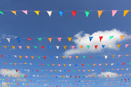 colorful triangle flag with beautiful sky backgroundの写真素材