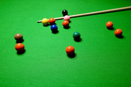 snooker balls and cue on snooker tableの写真素材