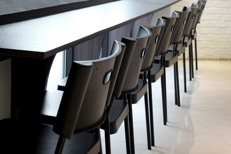 chair in front of counter bar at restaurant