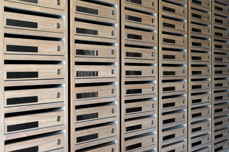 wooden mailboxes postal in a condominium buildingの写真素材
