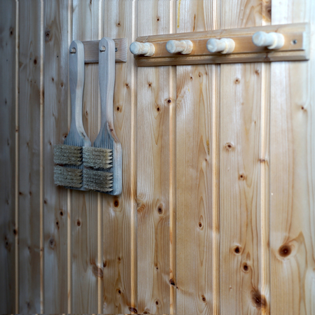 brush hanging on rack in the sauna roomの写真素材