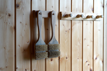 brush hanging on rack in the sauna roomの写真素材