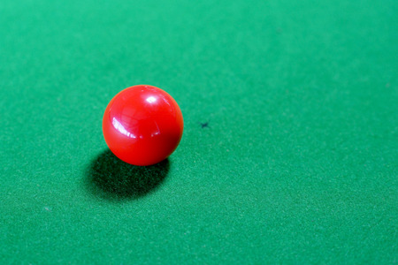 A red snooker ball on snooker tableの写真素材