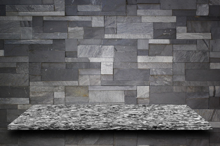 empty top of mable stone with granite wall backgroundの写真素材