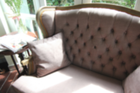 blurry photo of vintage armchair in living room