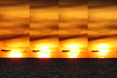 landscape view of peaceful ocean with beautiful sunrise backgroundの写真素材