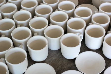 ceramic cups under production in pottery workshop
