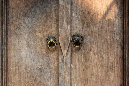 closeup image of ancient wooden doors in countryside