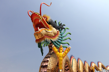 chinese dragon in shrine with blue sky backgroundの写真素材