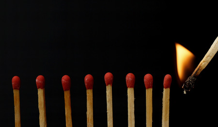 Row of matches isolated on black backgroundの写真素材