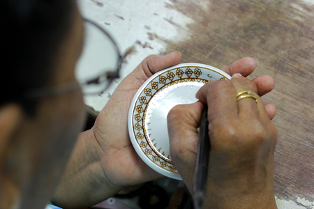artist painting benjarong ceramic ware , A traditional Thai five-colored famous porcelainの写真素材