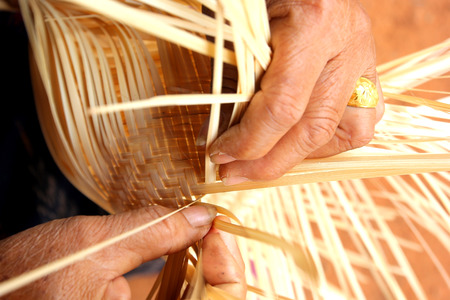 The villagers took bamboo stripes to weaving basket