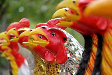 cock dolls, pile of ceramic rooster figure sculptureの写真素材