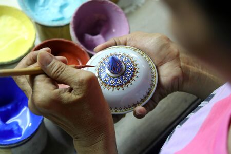 artist painting benjarong ceramic ware , A traditional Thai five-colored famous porcelainの写真素材