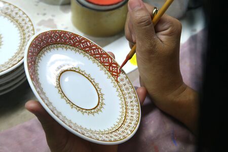 artist painting benjarong ceramic ware , A traditional Thai five-colored famous porcelainの写真素材