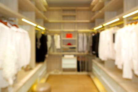 blurred wide dressing room with wardrobe in modern house as backgroundの写真素材