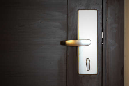 hotel electronic card lock on wooden doorの写真素材