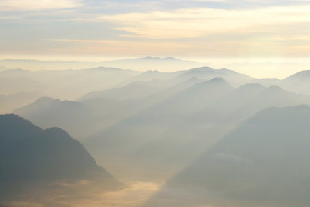 landscape photo, misty mountain hills in the morningの写真素材