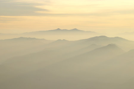 landscape photo, misty mountain hills in the morningの写真素材