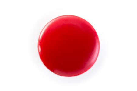 red button on a white backgroundの写真素材