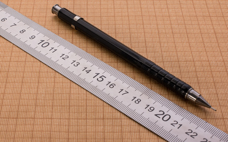 mechanical pencil and ruler on graph paperの写真素材