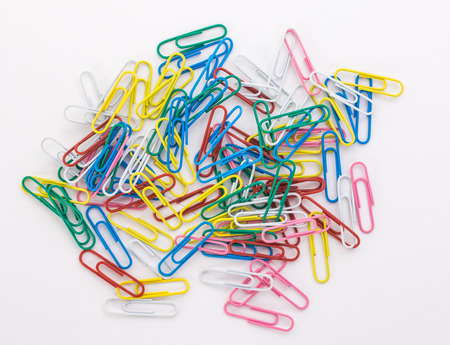 colored paper clips on a white backgroundの写真素材