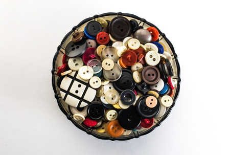 buttons in a vase on a white background