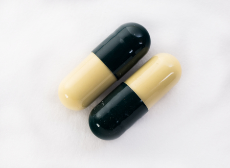 tablets pills on a white backgroundの写真素材