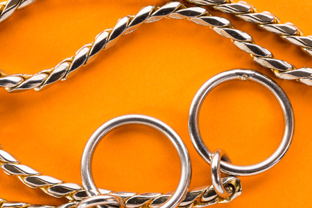 metal chain closeup on an orange background